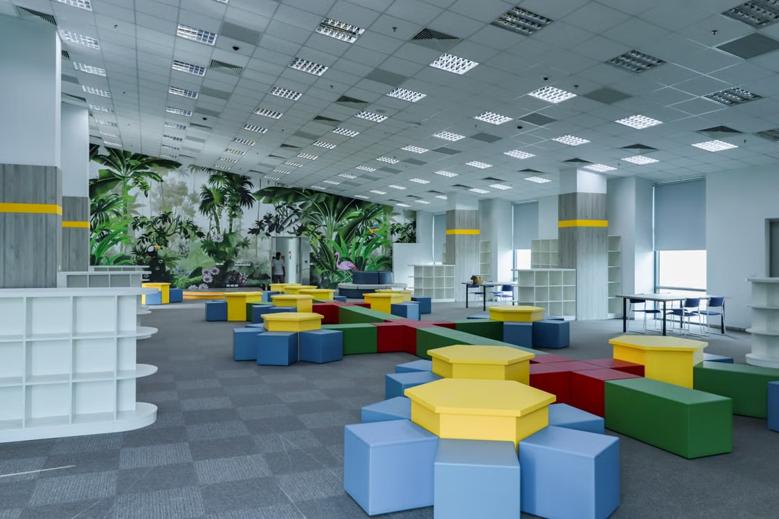 Bright hexagonal seating blocks in a colorful indoor play lounge
